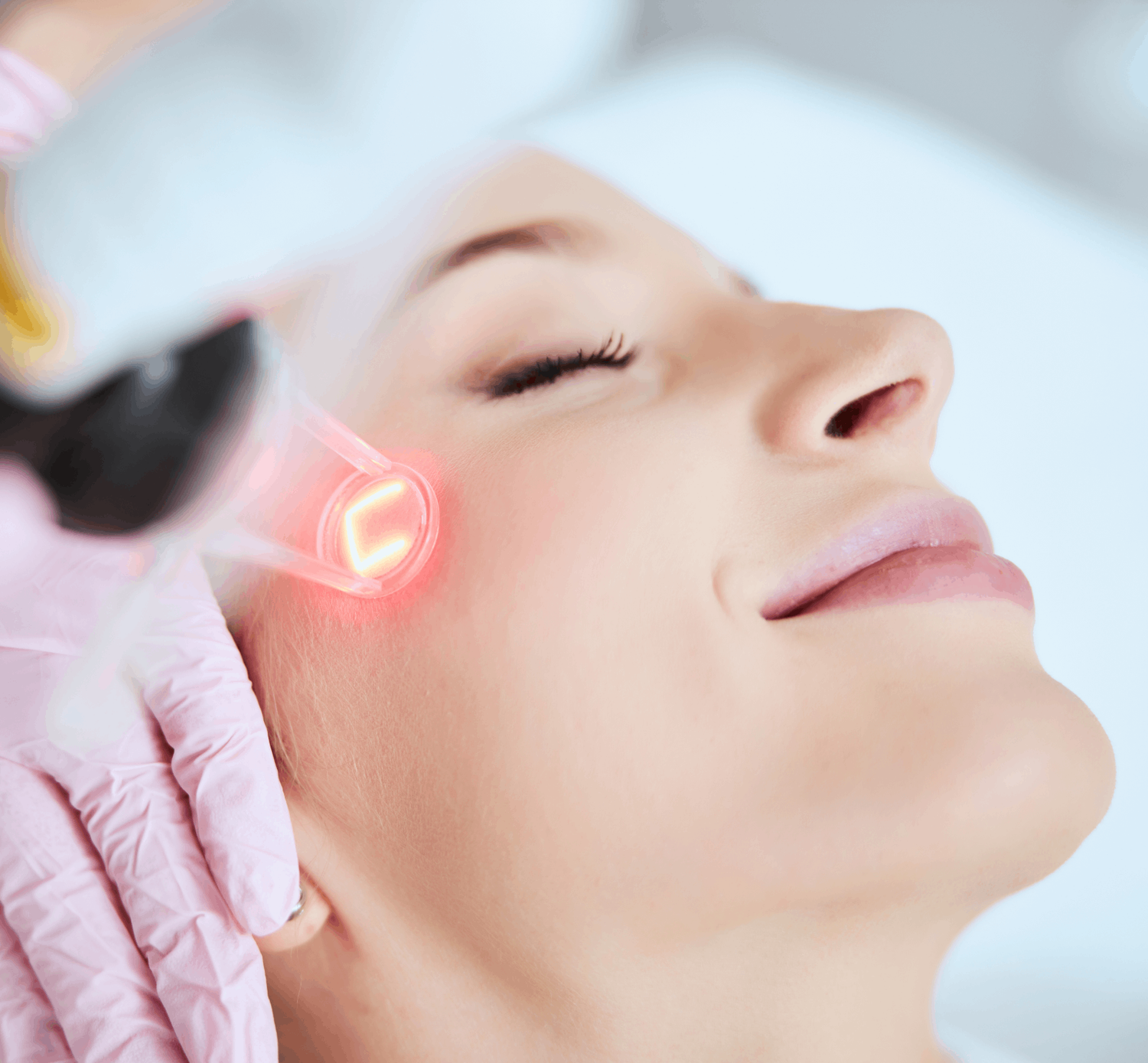 Woman undergoing a professional aesthetic skin treatment to support skin hydration, resilience, and radiance.